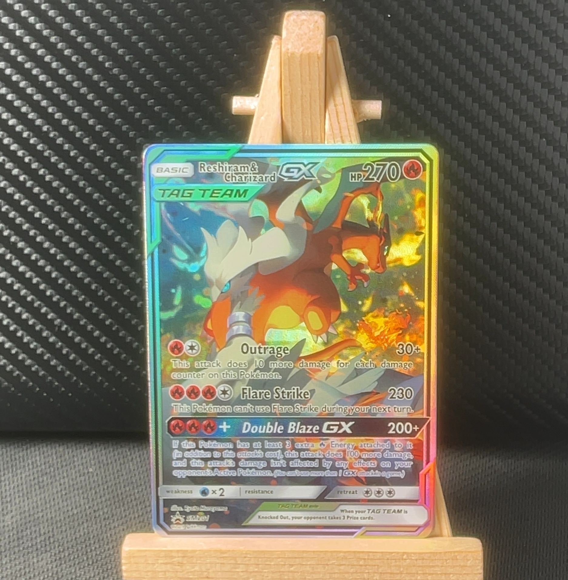 Foil detail of Reshiram & Charizard GX — SM Promos SM201